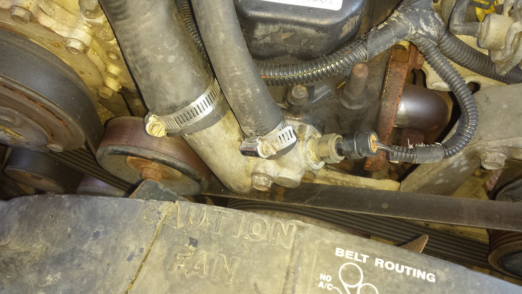 This is the thermostat housing attached to the block. The big hose goes to the radiator,  the small hose goes to your heater core, and the temp sensor is on the right.