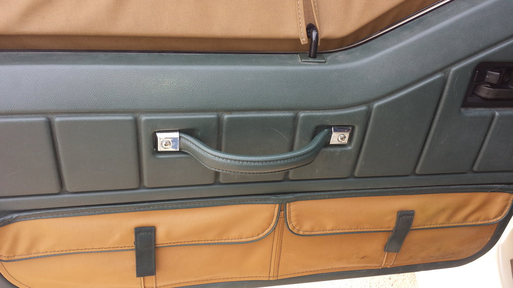 Driver's door handle replaced. Looking good.