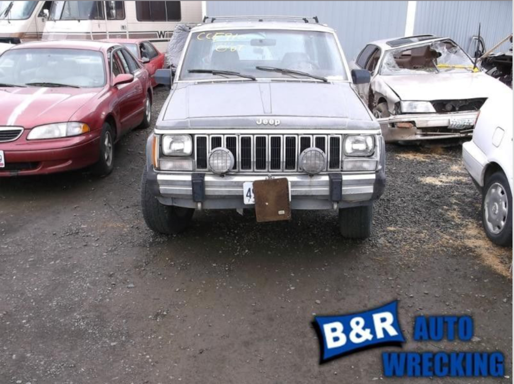 XJ with a pair of YJ Sahara fog lights.
