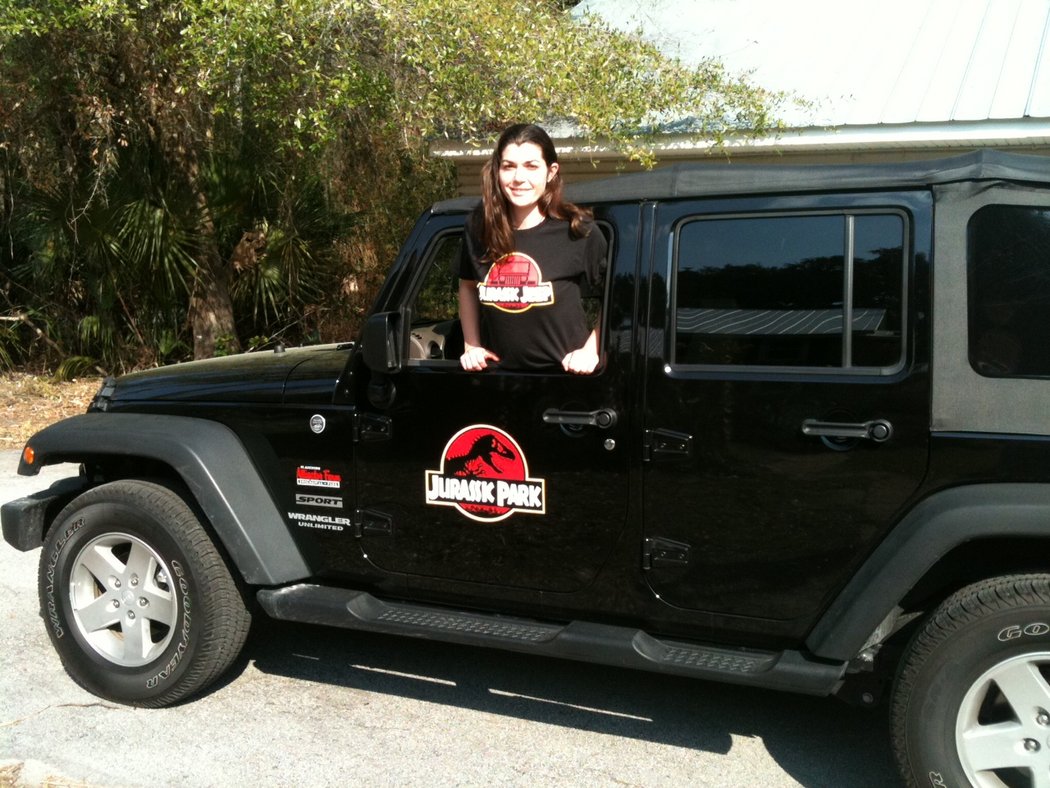 Jen in the jeep with her Jurassic Jeep t-shirt on.