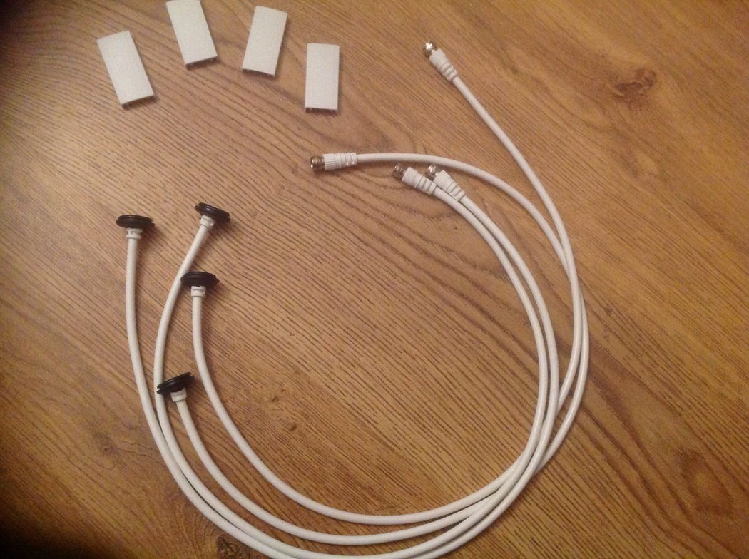 White sat TV cable &amp; blank hole fillers as the black bit. The white tab is the top of a cable tidy cut to size.