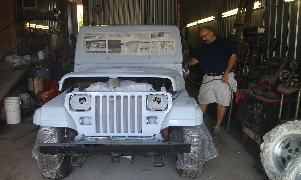 My dad finishing up the primer coat