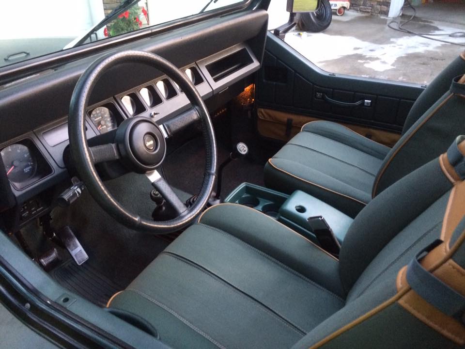 Had an upholstery shop replace a part of the seat cushion with oem fabric.